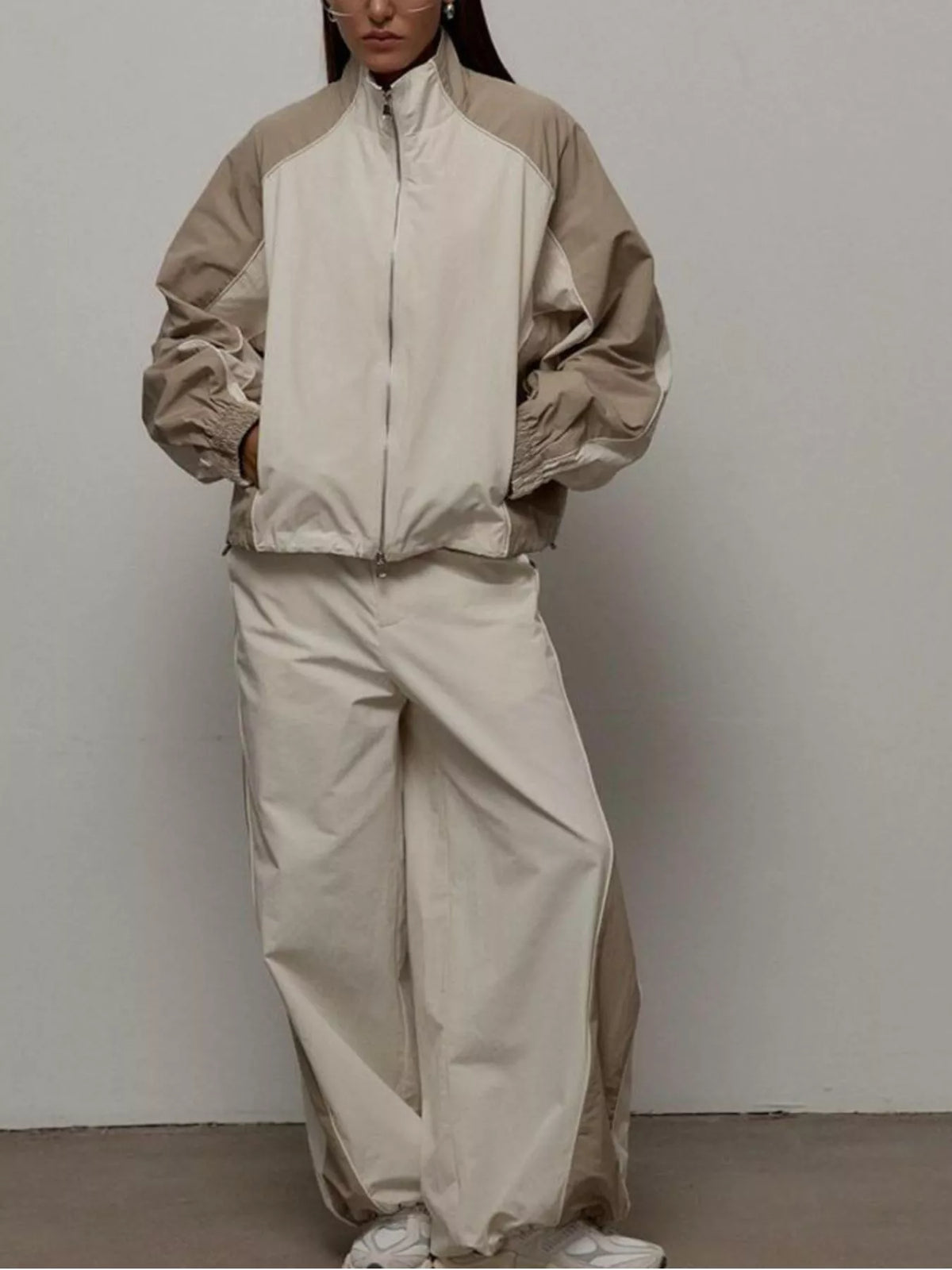 Color block zip-up outerwear and pants set by Plush Fashion Hub, featuring vibrant color blocking and comfortable fit.