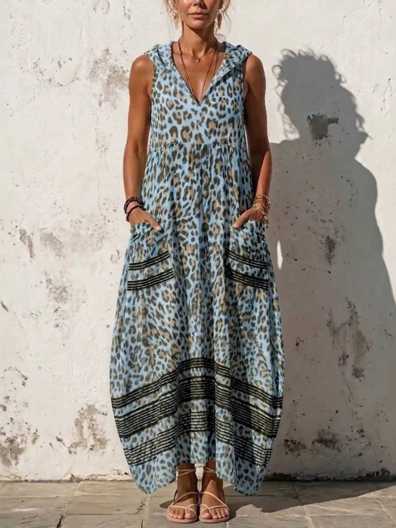 Plus size leopard print sleeveless hooded maxi dress with pockets, casual summer dress from Trendsi.