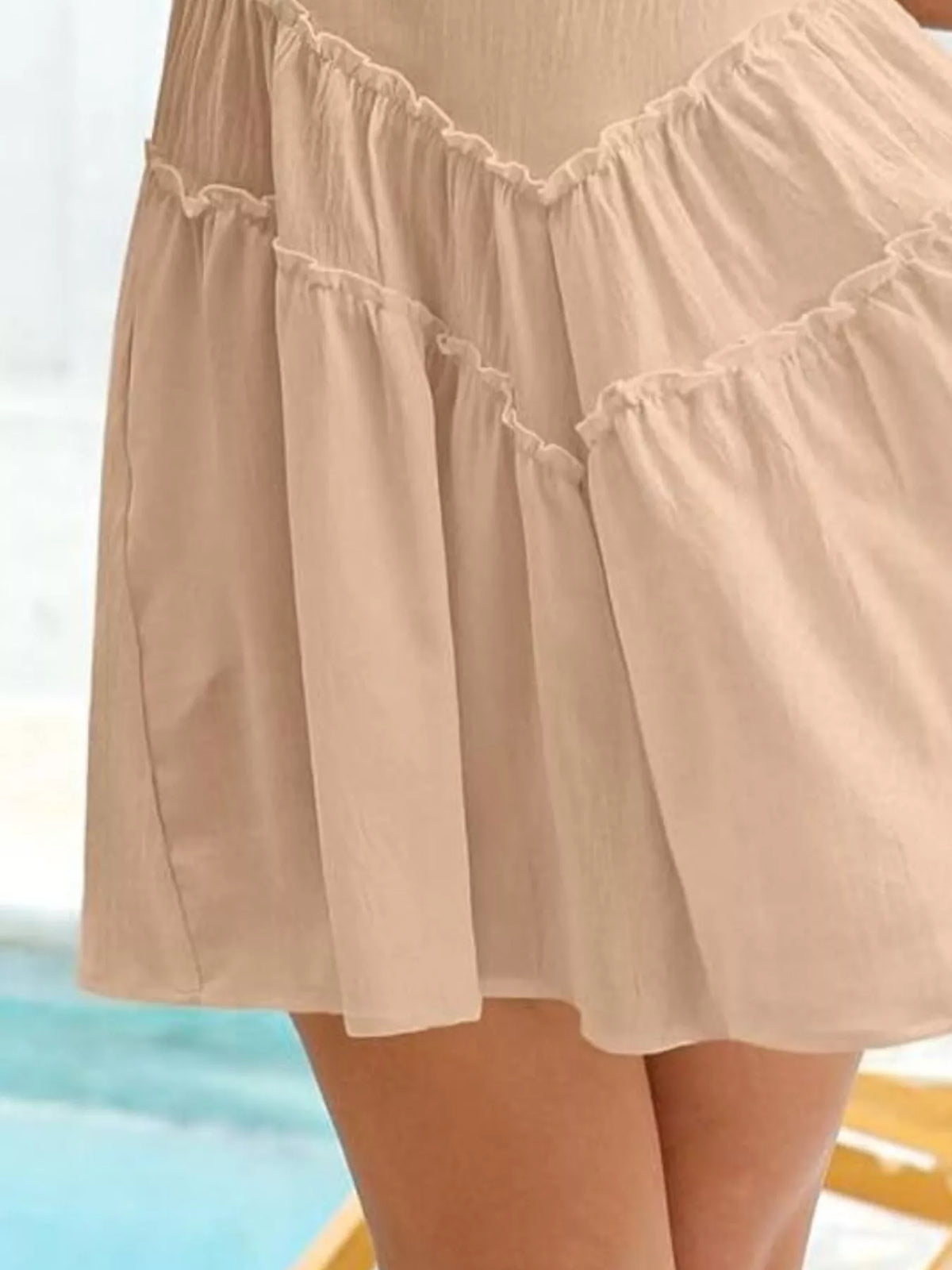 Women’s sleeveless round neck mini dress with pockets by Plush Fashion Hub, shown in a stylish design on a model.