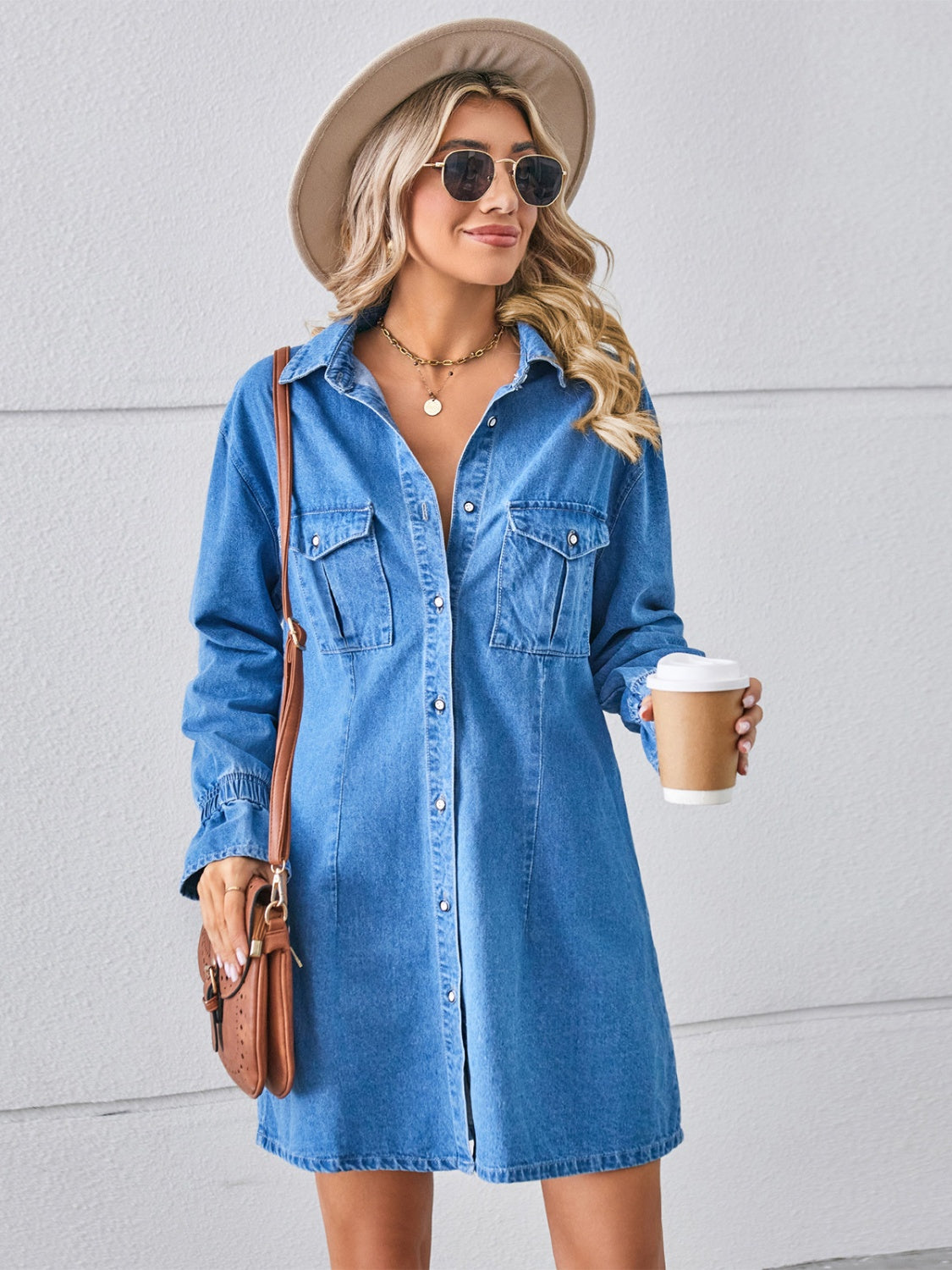 Plush Fashion Hub pocketed dropped shoulder mini denim dress featuring relaxed fit and casual style, displayed on a hanger.