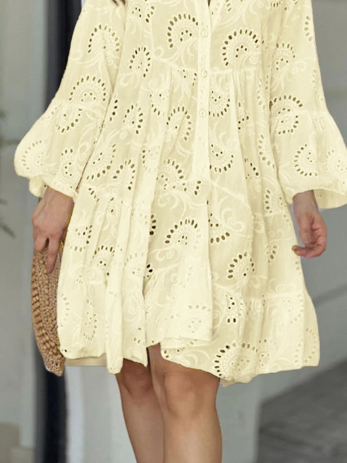 Plus size full-length eyelet ruffled hem tiered dress by Trendsi, showing a flowing, layered dress with eyelet details.