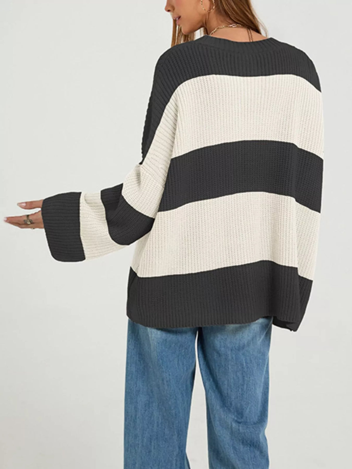 Color block striped button-up cardigan by Trendsi featuring vibrant color panels and a classic button front detail.