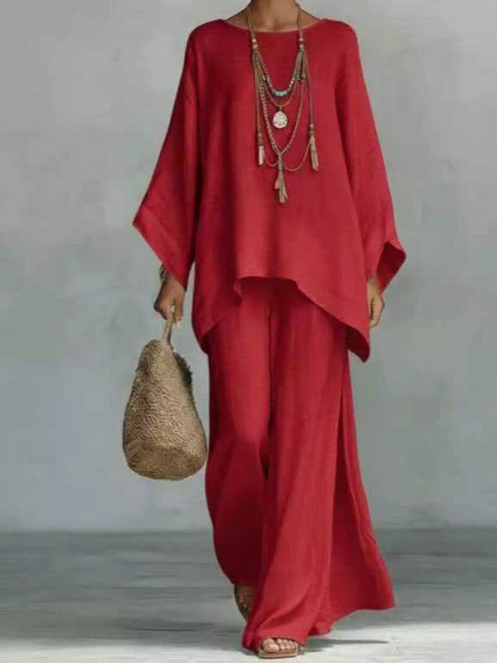 Plus size full size round neck top and wide leg pants set by Trendsi, casual stylish pant set, front view.