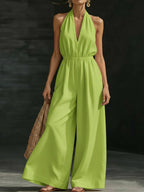 Women’s V-neck halter neck wide-leg jumpsuit by FitiqueFit, casualwear, shown in a stylish, comfortable design for women.