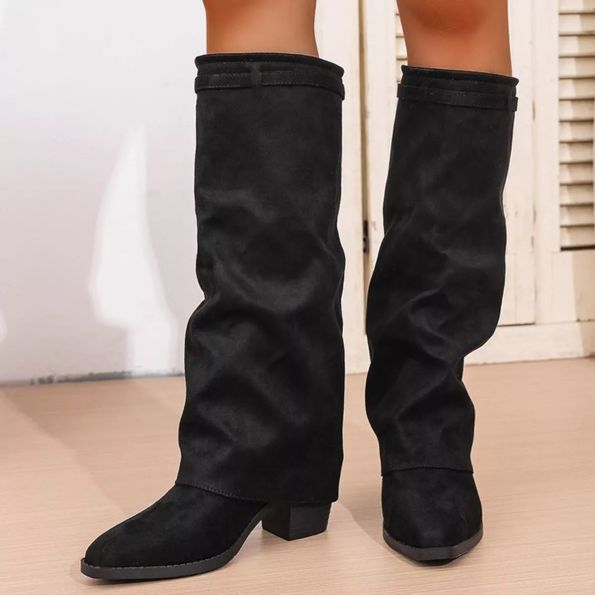 Point toe block heel boots by Trendsi featuring sleek black footwear with a stylish pointed toe and sturdy block heel.
