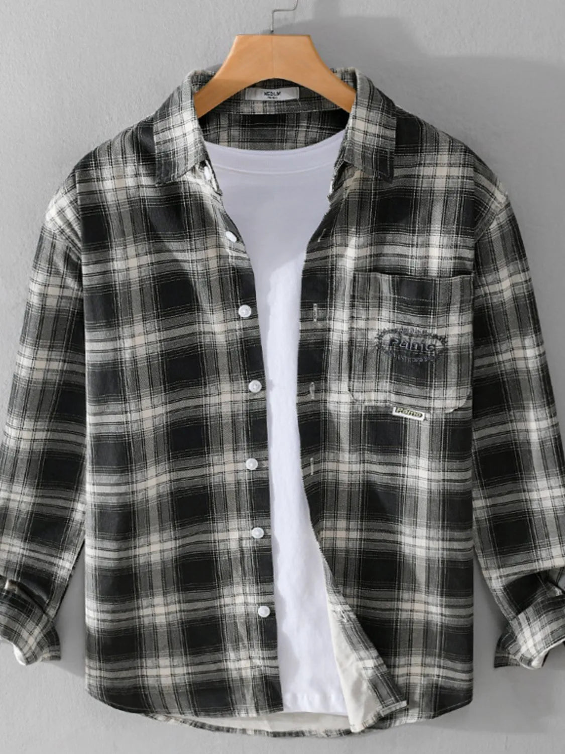 Men's plus size plaid button-up long sleeve shirt by Trendsi, featuring a classic checkered pattern and tailored fit.