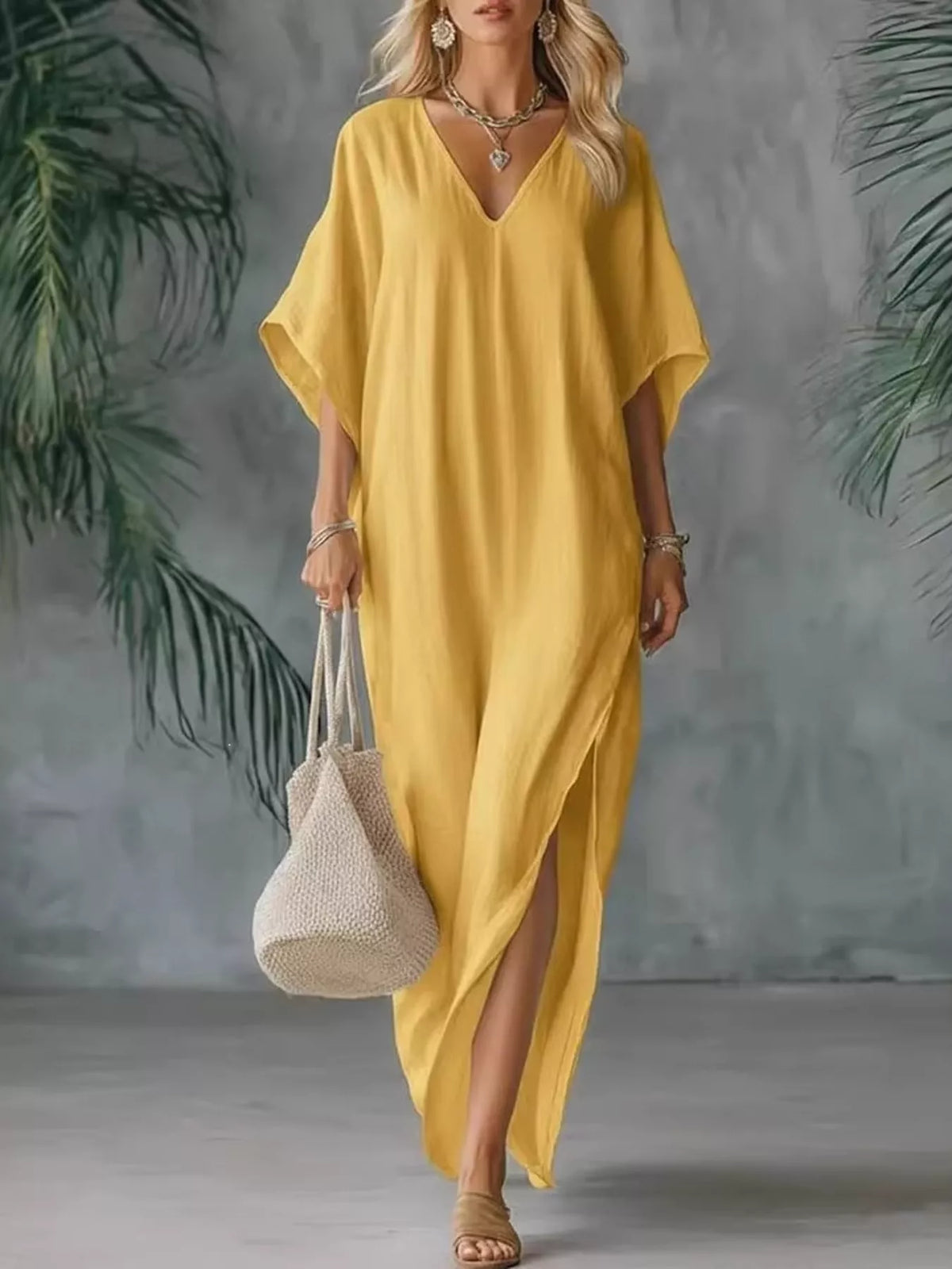 Plush Fashion Hub plus size V-neck maxi dress with side slits, flowing fabric, and full-length design for a stylish look.