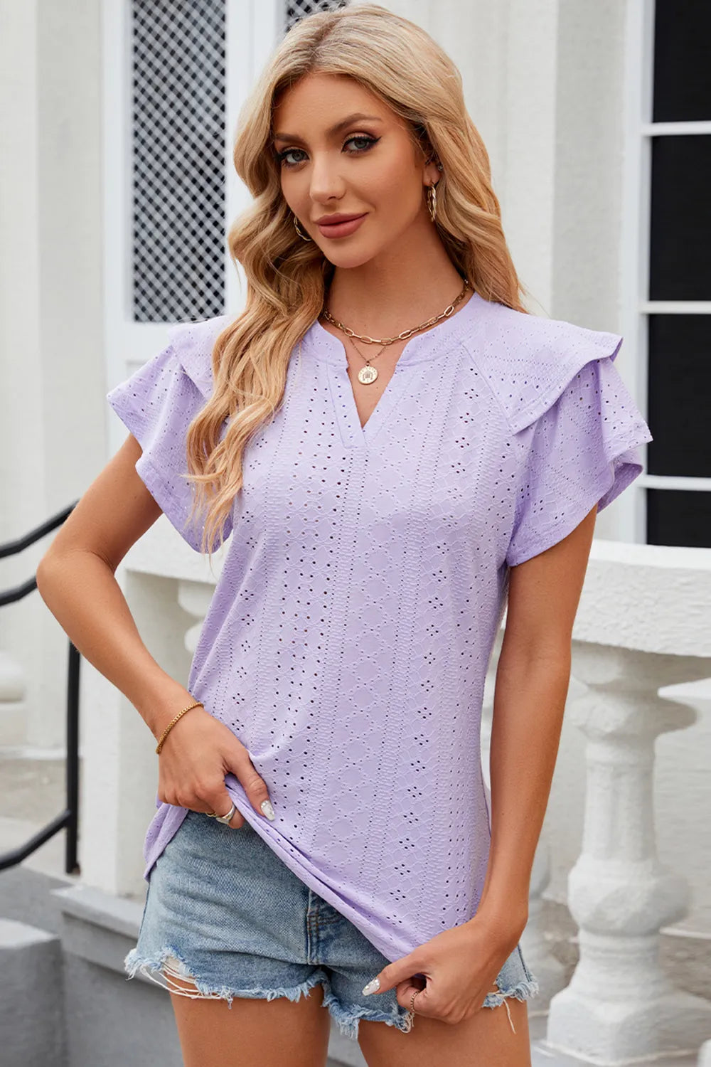 Pink eyelet notched flutter sleeve T-shirt from Plush Fashion Hub featuring a relaxed fit and stylish sleeve design.