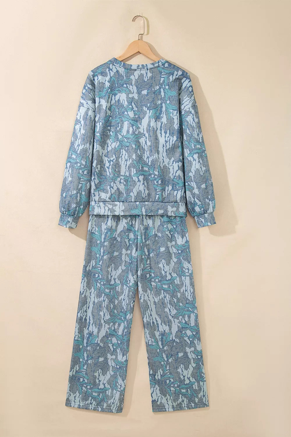 Multicolour abstract botanical print top and drawstring pants set by Trendsi, featuring vibrant pattern and casual comfort.