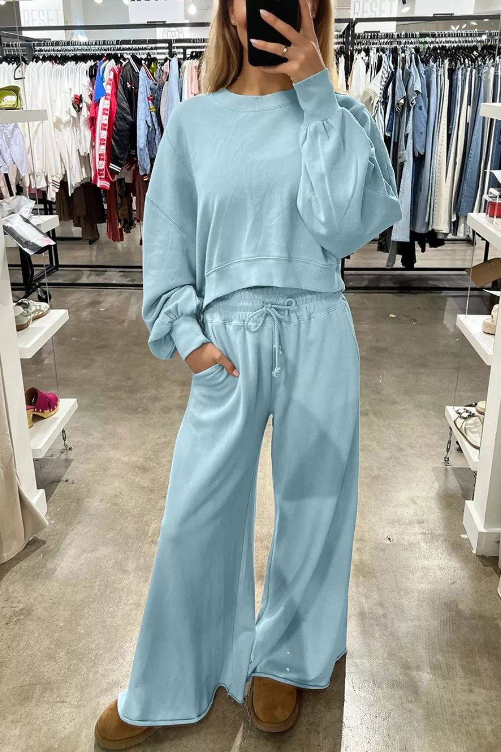 Drop shoulder puff sleeve crop pullover and wide-leg pants set by Trendsi, featuring stylish, comfortable coordinated outfit in soft fabric.