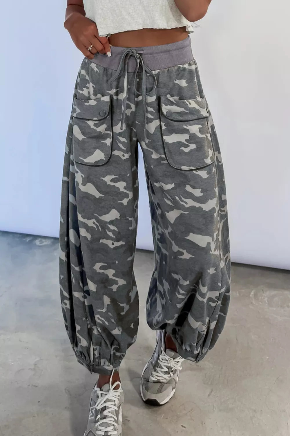 Multicolour camouflage cargo barrel pants with contrast waistband and drawstring from Plush Fashion Hub, shown on a model.