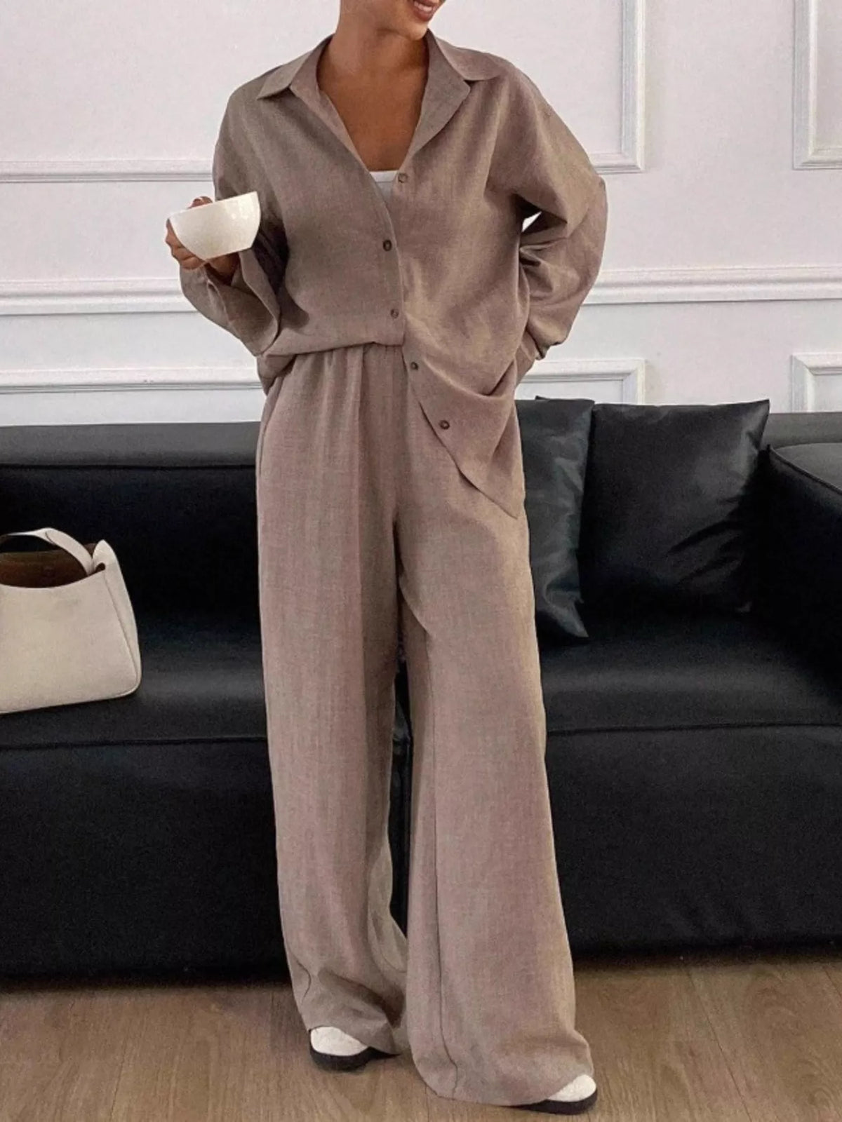 Trendsi long sleeve button-up shirt and wide-leg pants set, featuring a stylish coordinated outfit in soft fabric.