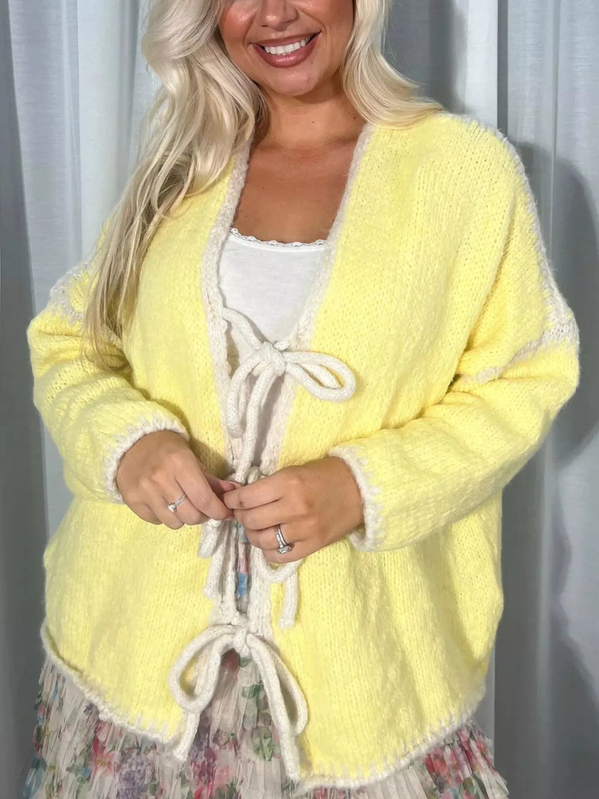 Light beige tie front drop shoulder cardigan with long sleeves, soft knit fabric, and relaxed fit from Trendsi.