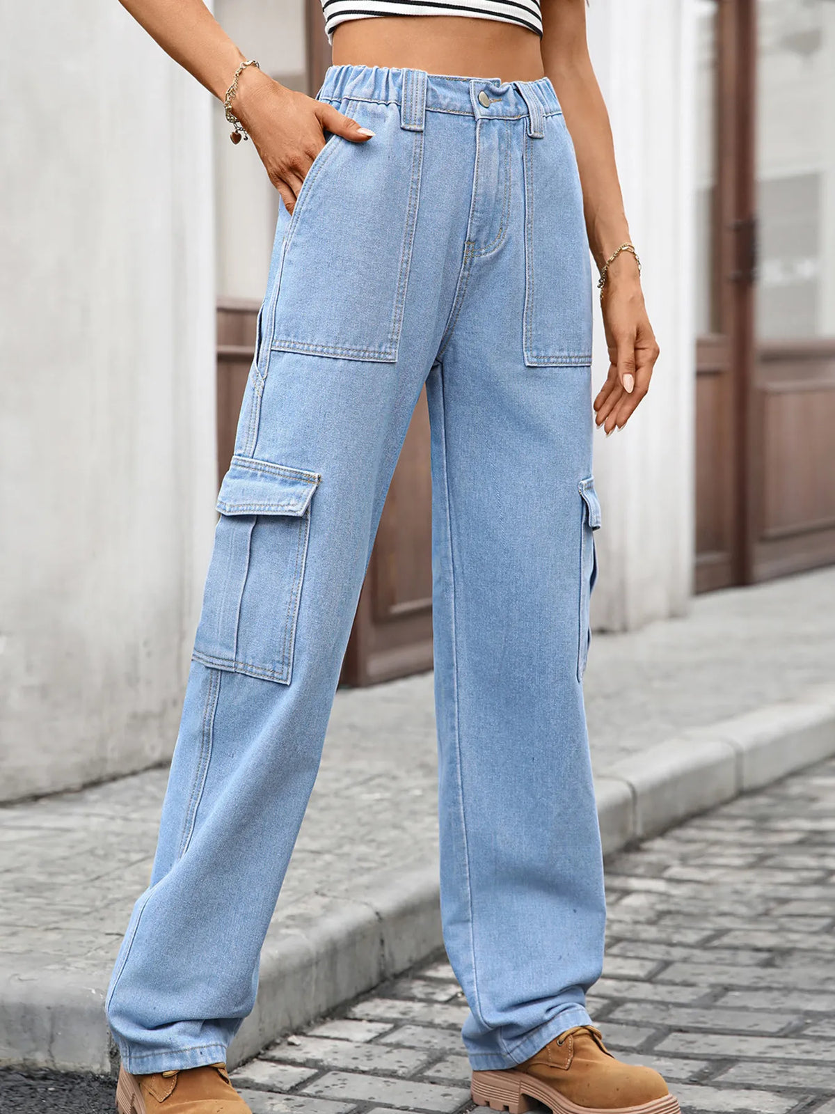High-waisted cargo denim jeans by Plush Fashion Hub featuring multiple pockets and a relaxed fit on model.
