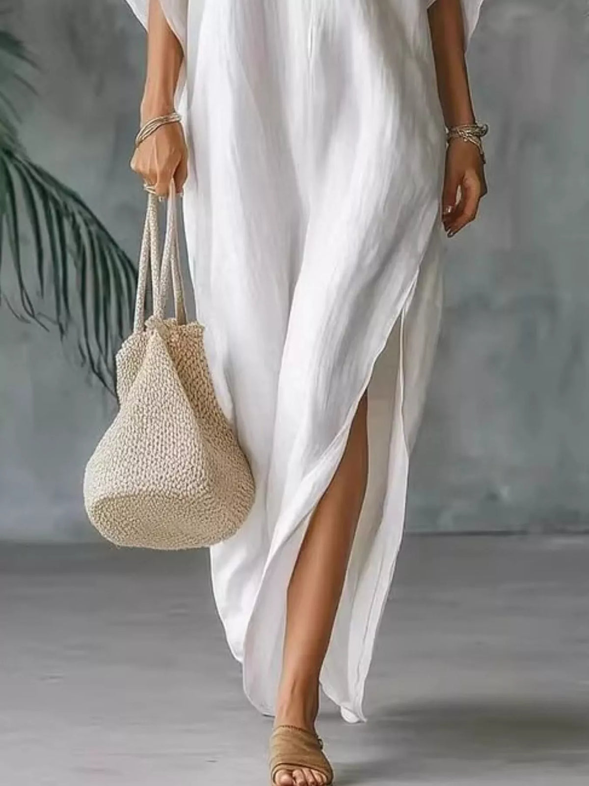 Plush Fashion Hub plus size V-neck maxi dress with side slits, flowing fabric, and full-length design for a stylish look.