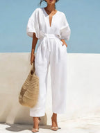 Trendsi tie waist wide-leg bodysuit featuring a fitted top with a flattering waist tie and flowing wide-leg pants.