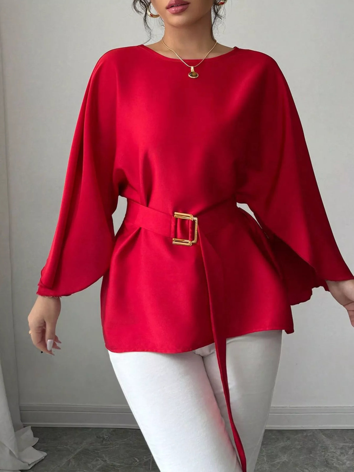 Plush Fashion Hub batwing sleeve belted blouse with relaxed fit and stylish design, featuring wide sleeves and a waist belt.
