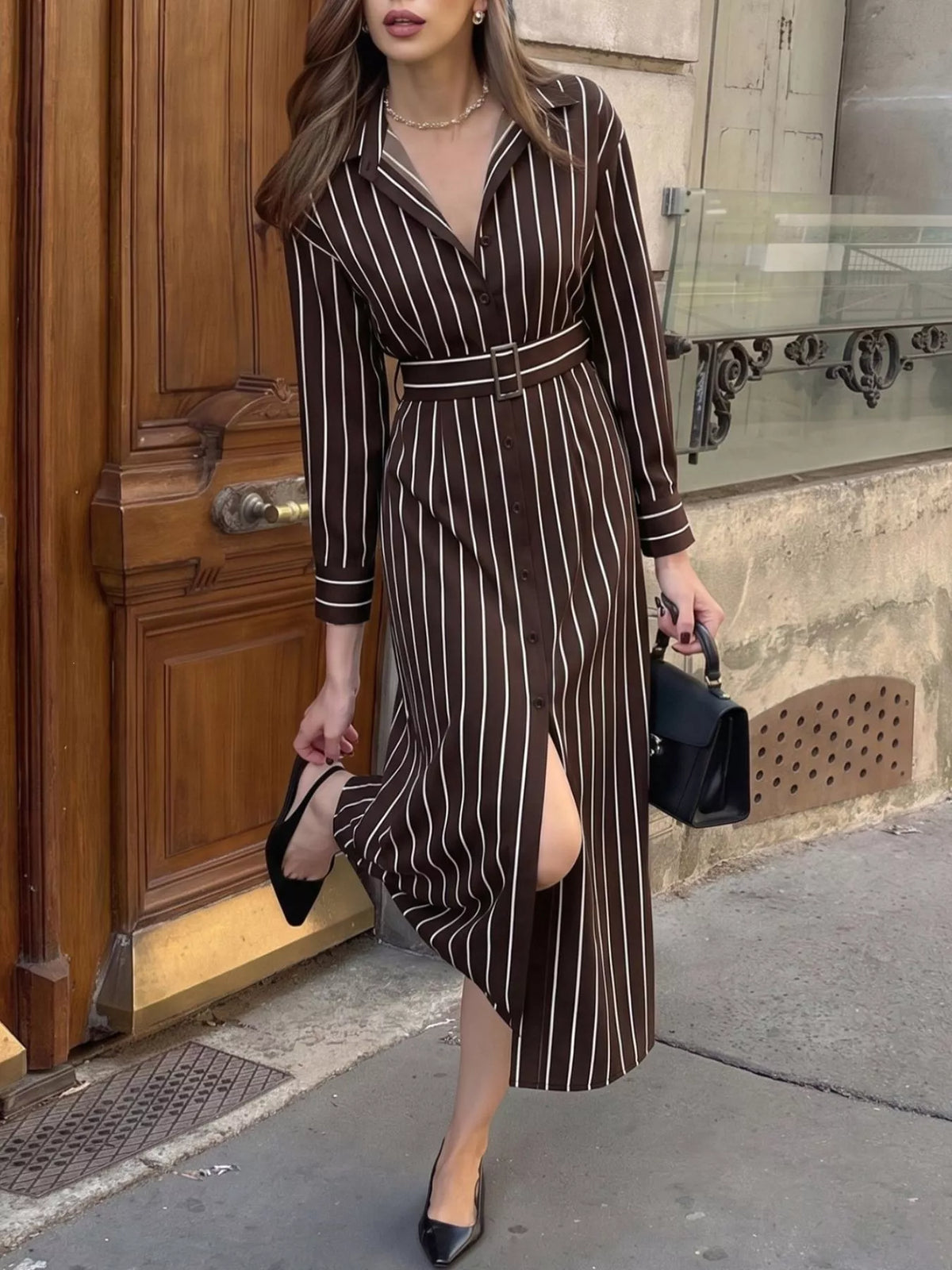 Striped long sleeve belted shirt dress for women by Trendsi, featuring a classic pattern and tailored fit.