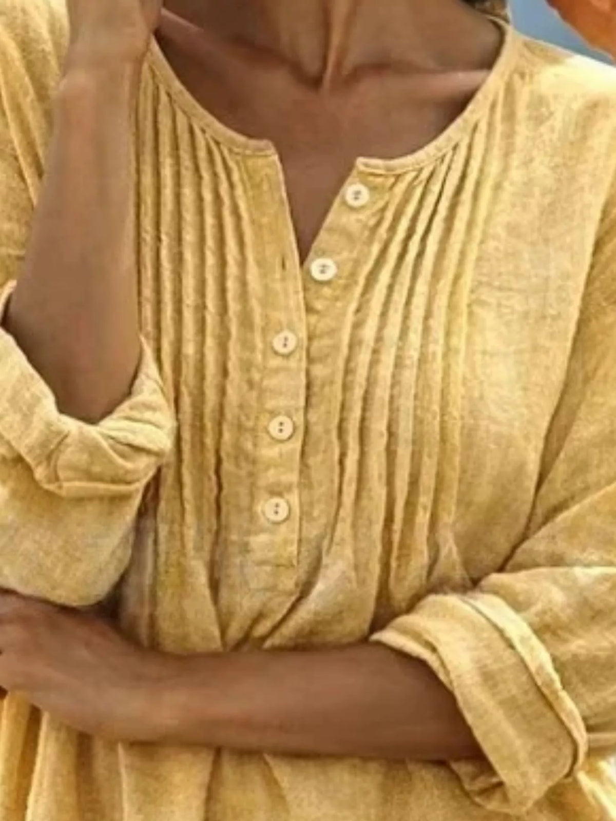 Casual long sleeve linen shirt with button details from Trendsi, featuring a relaxed fit and natural fabric for comfortable style.