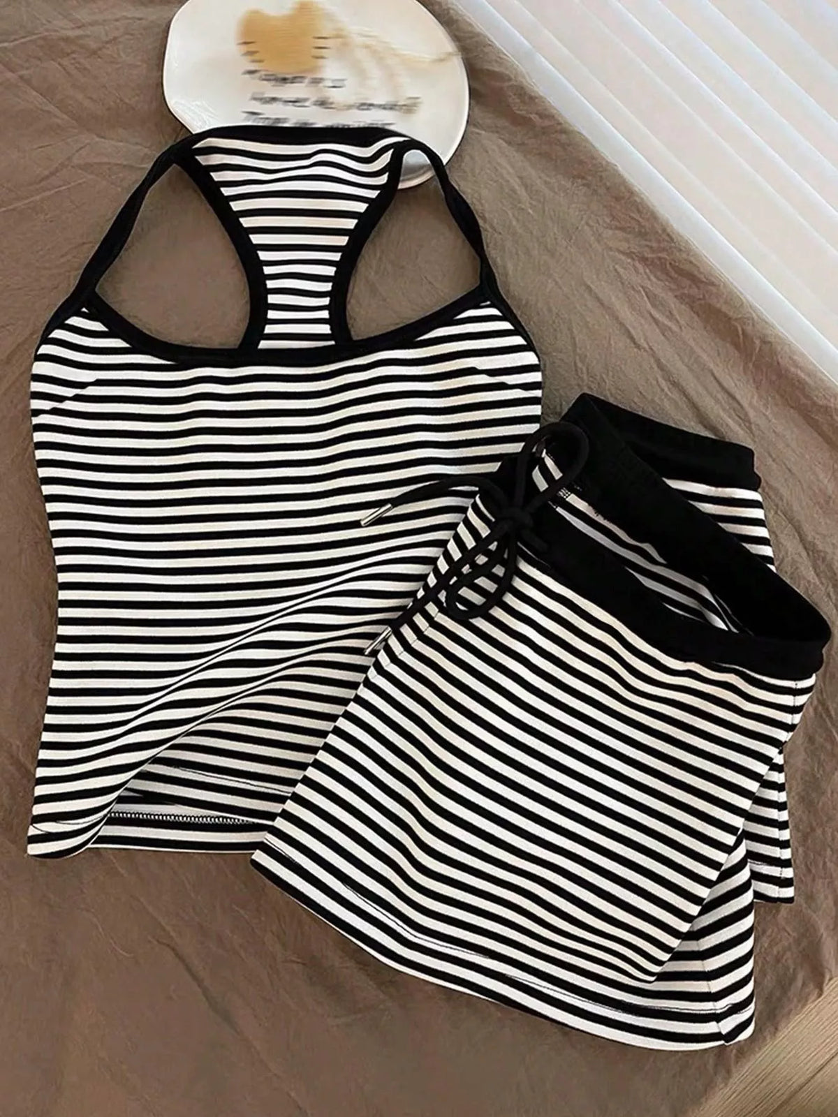 Striped tank top and shorts set by Plush Fashion Hub, casual summer outfit with blue and white stripes, made of comfortable fabric.