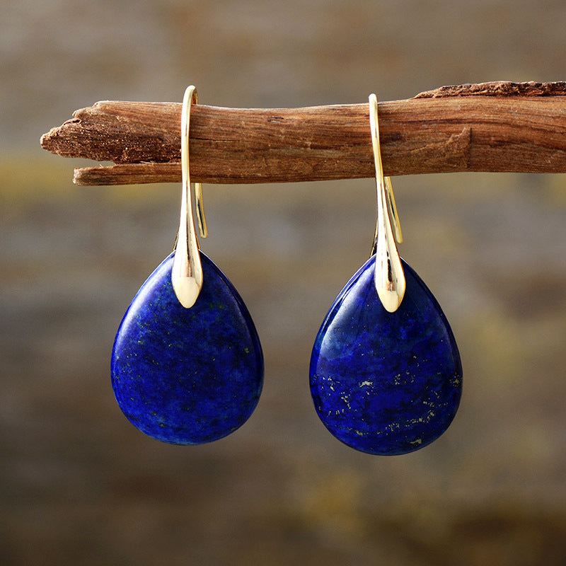 Elegant Crystal Dangle Earrings from Plush Fashion Hub featuring sparkling crystal accents and a sleek design.
