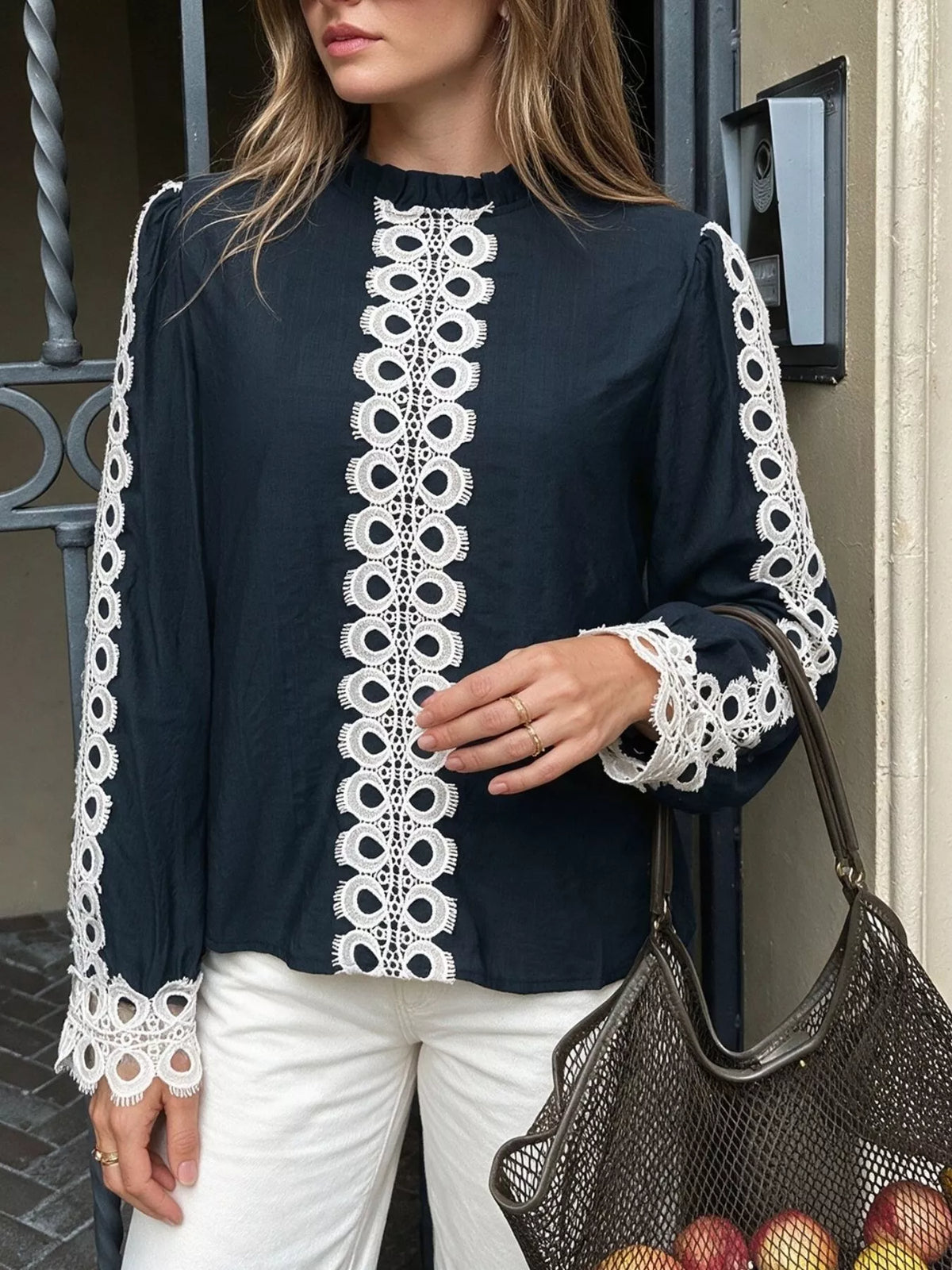 Lace trim long sleeves blouse by Trendsi featuring delicate lace details and a classic fit, worn by a model.