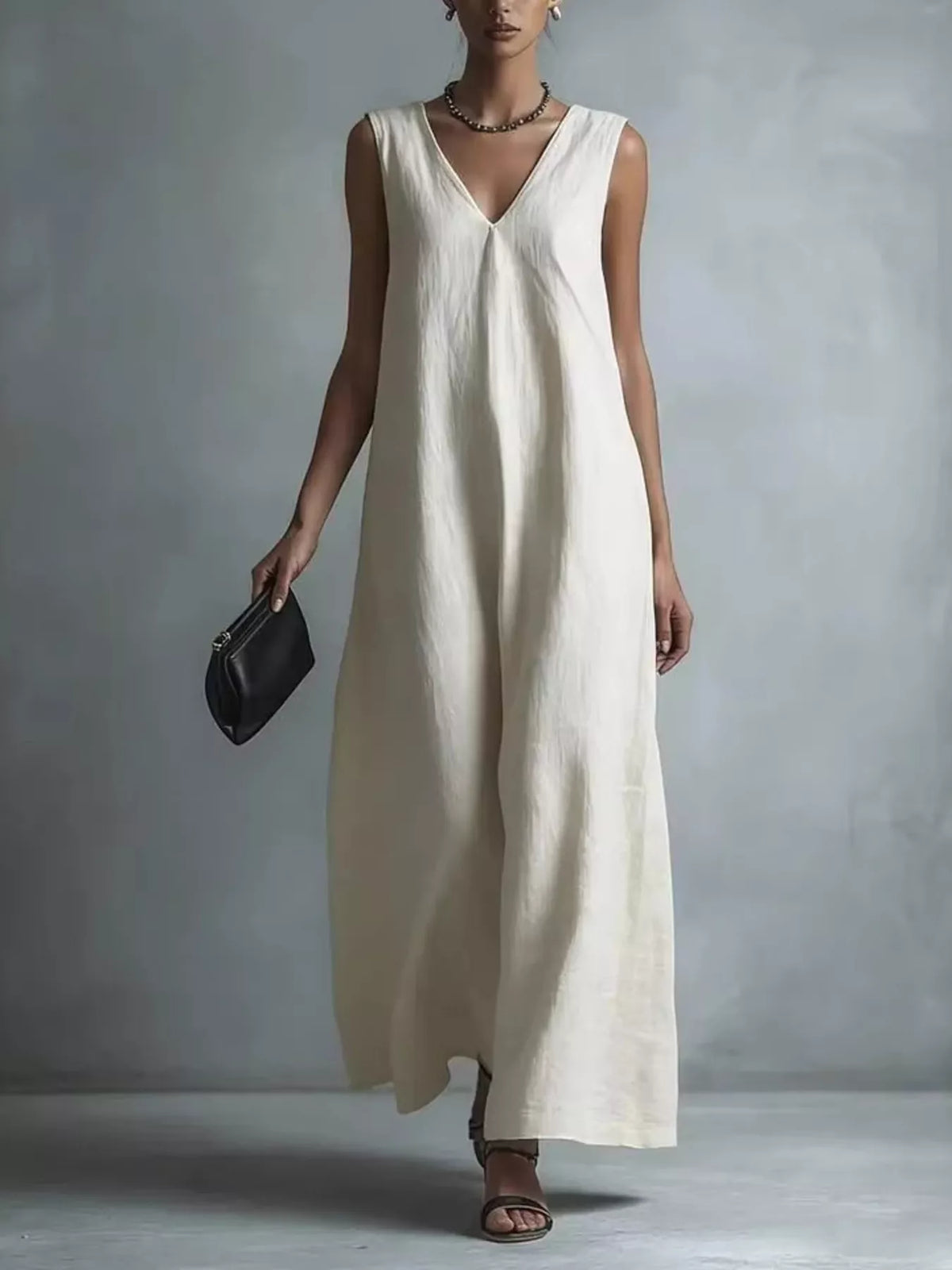 Plus size full V-neck sleeveless maxi dress by Plush Fashion Hub, flowing fabric and elegant design perfect for summer wear.