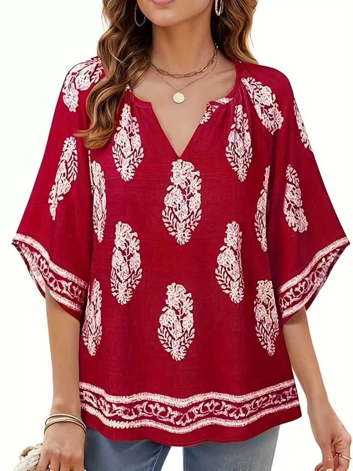 Printed notched 3/4 sleeve blouse from Plush Fashion Hub featuring a stylish design and comfortable fit.