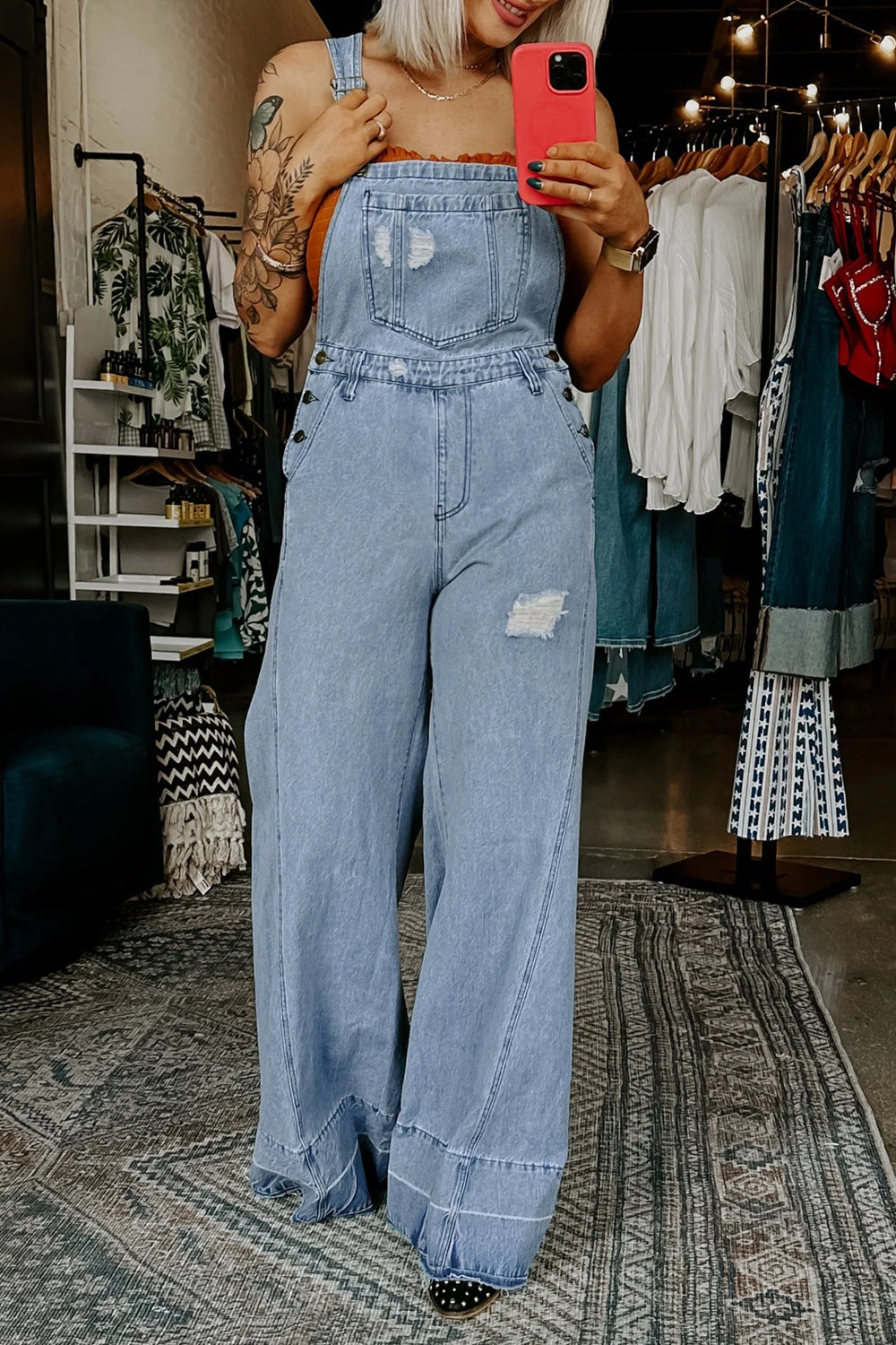 Women's distressed wide leg denim overalls from Plush Fashion Hub, featuring relaxed fit and casual style, shown on a model.