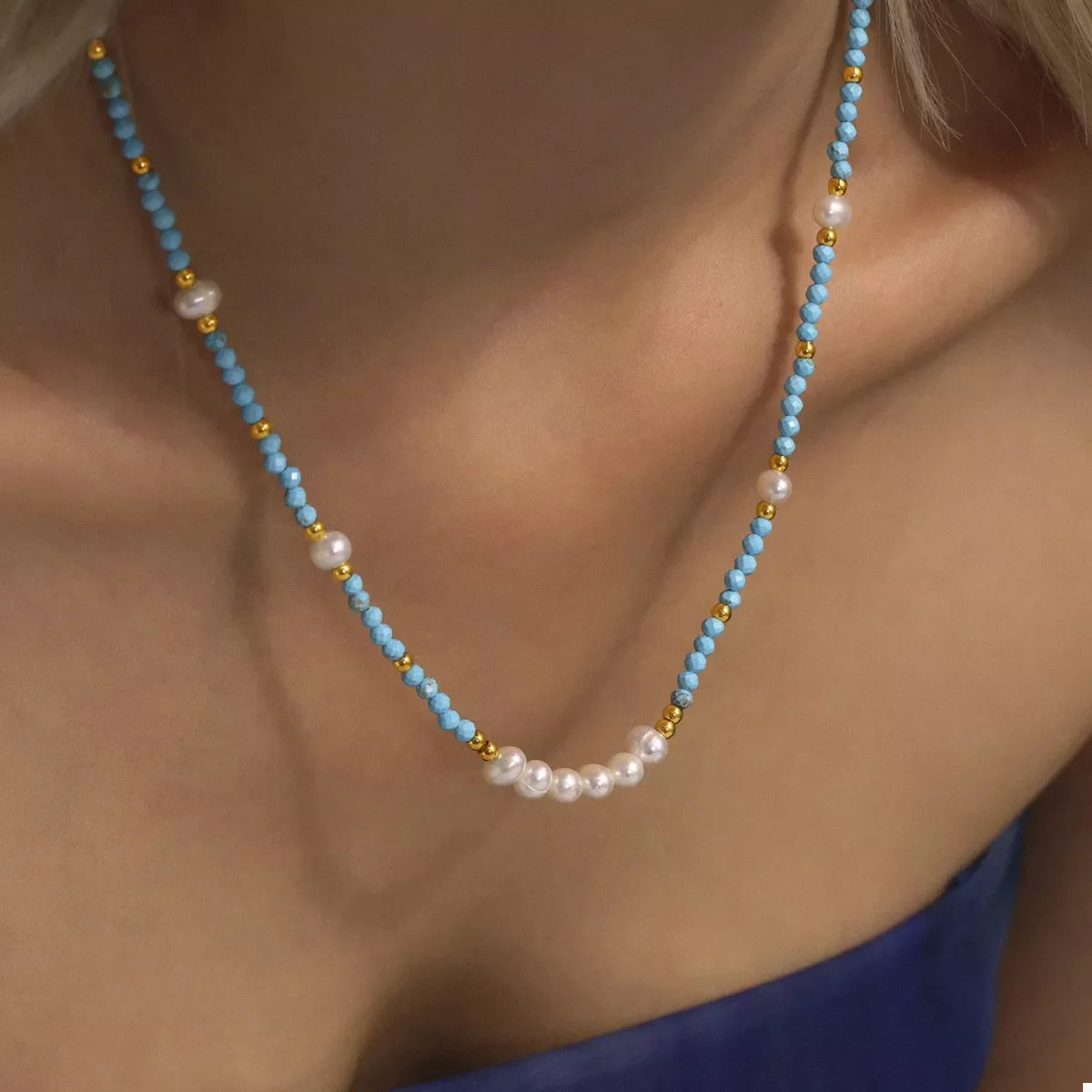 Turquoise pearl beaded necklace by Plush Fashion Hub featuring a string of vibrant turquoise and pearl beads on a delicate chain.
