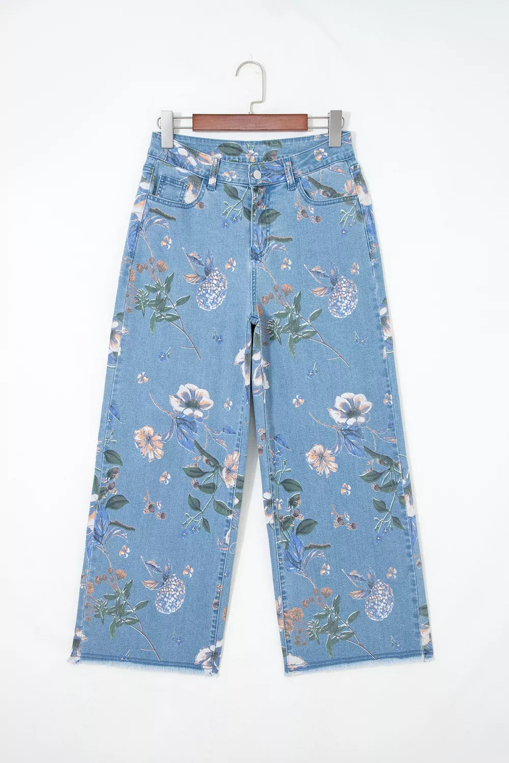 Trendsi floral print wide-leg jeans featuring a high waist, colorful floral pattern, and relaxed fit on model.