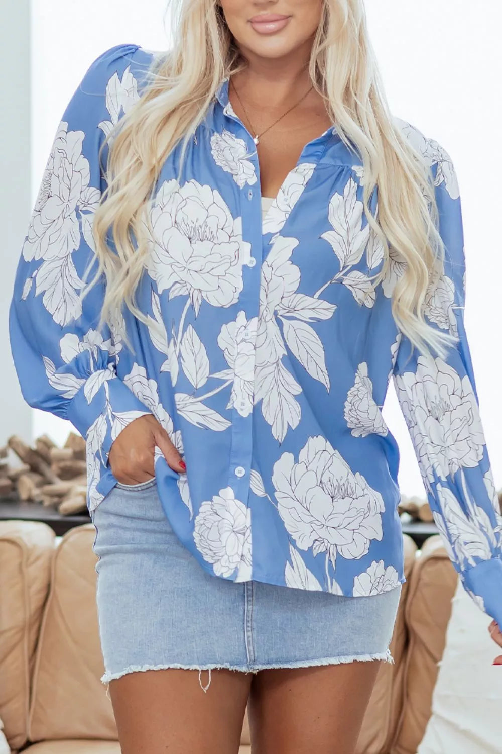 Women's floral print button-up shirt in lightweight fabric, featuring a classic collar and long sleeves, from Trendsi.