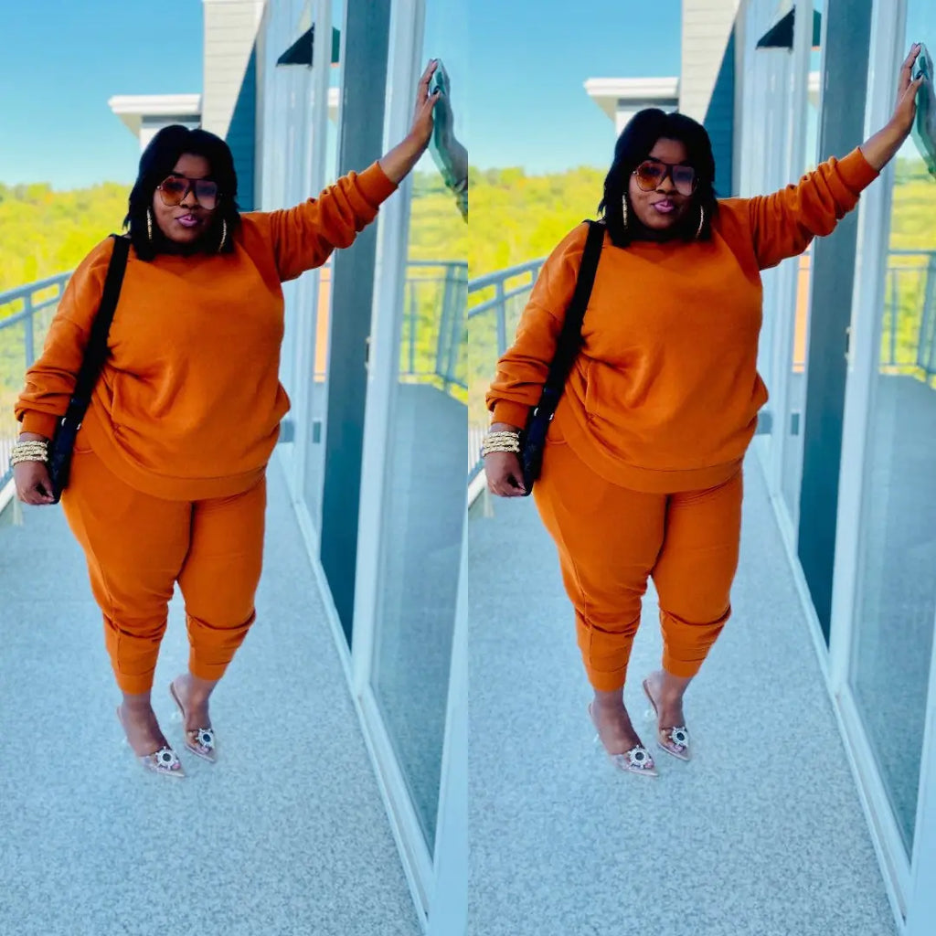 Plus size women's casual two-piece outfit featuring a stylish top and matching pants from Trendy Attic Store01.
