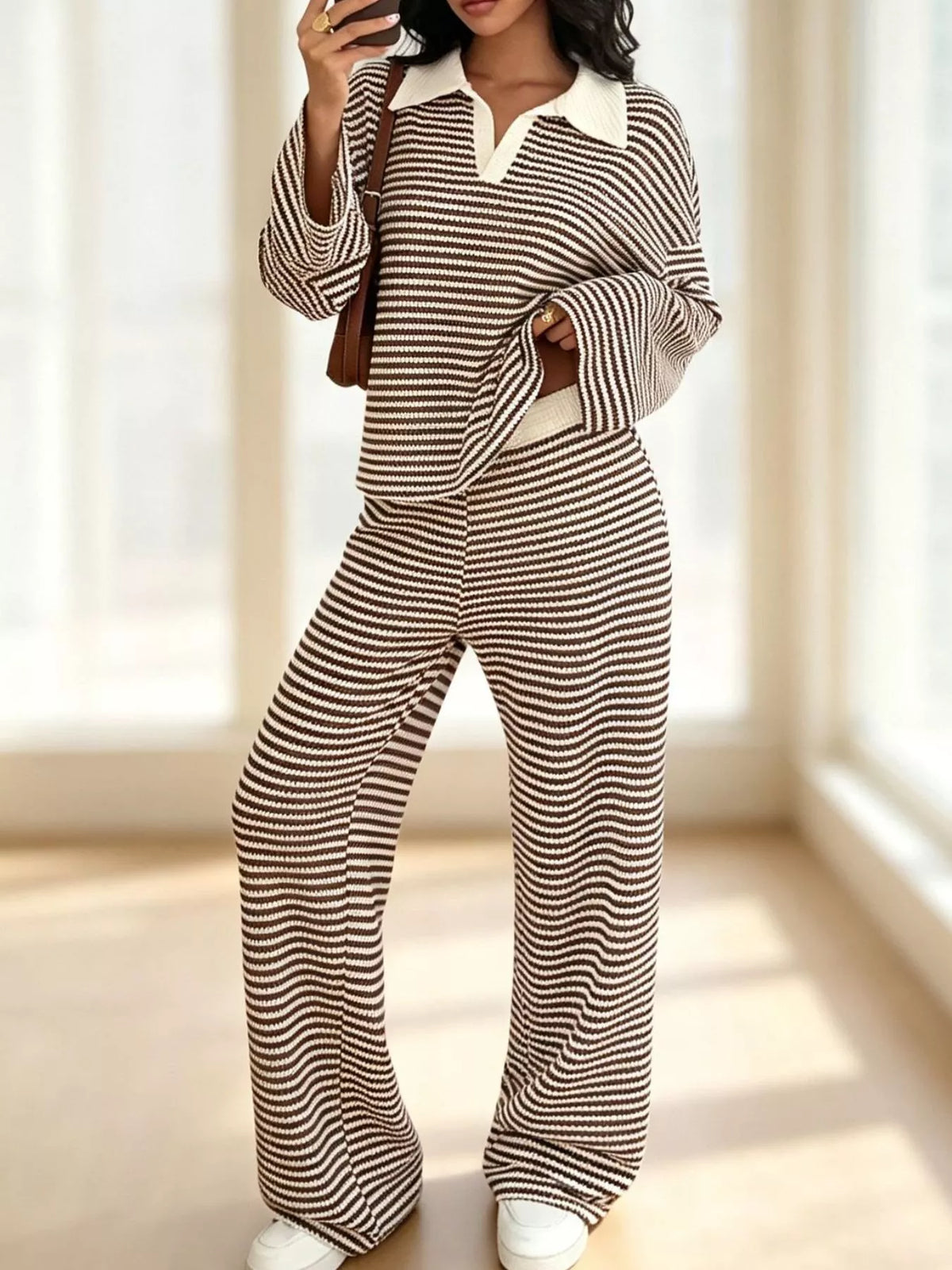 Striped long sleeve polo shirt and wide-leg pants set by Trendsi, featuring a stylish casual look with bold stripes and comfortable fit.