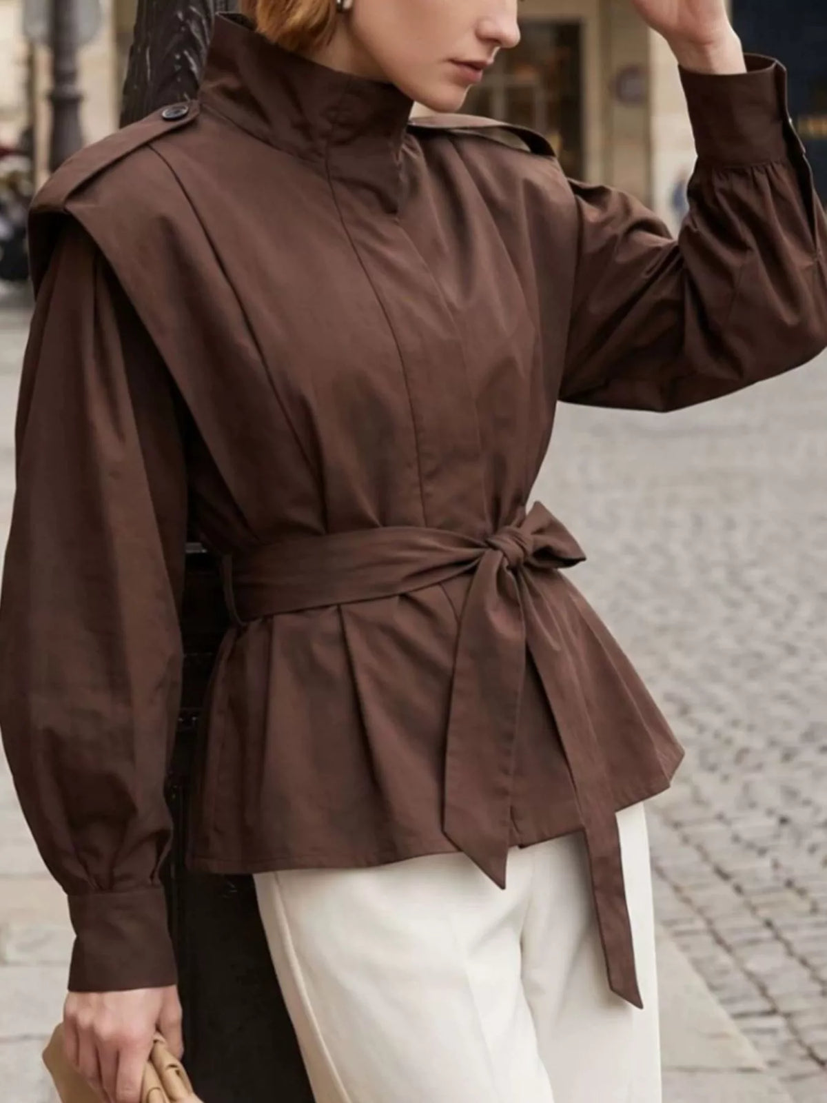 Trendsi stand-collar belted outerwear in neutral fabric, featuring a front belt and tailored design for a stylish look
