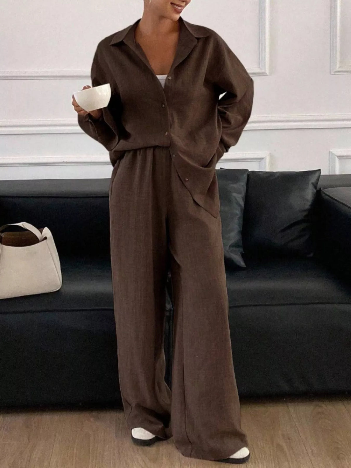 Trendsi long sleeve button-up shirt and wide-leg pants set, featuring a stylish matching outfit with a relaxed fit.