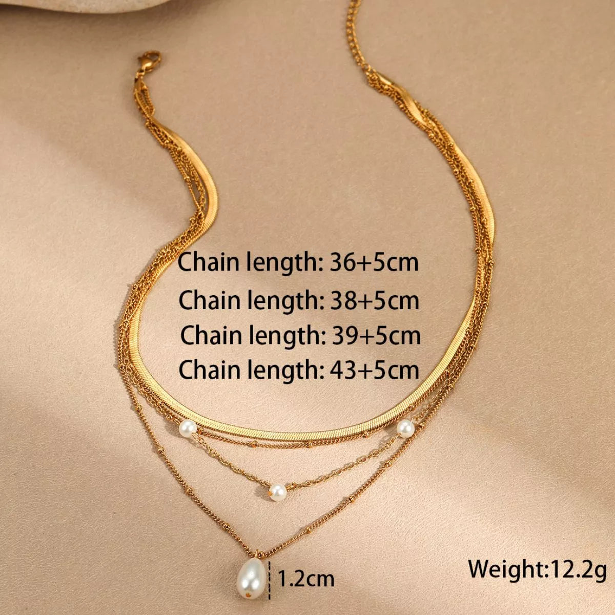 18K gold-plated four-layered pearl necklace with elegant white pearls and gold accents, showcasing a stylish layered jewelry design.