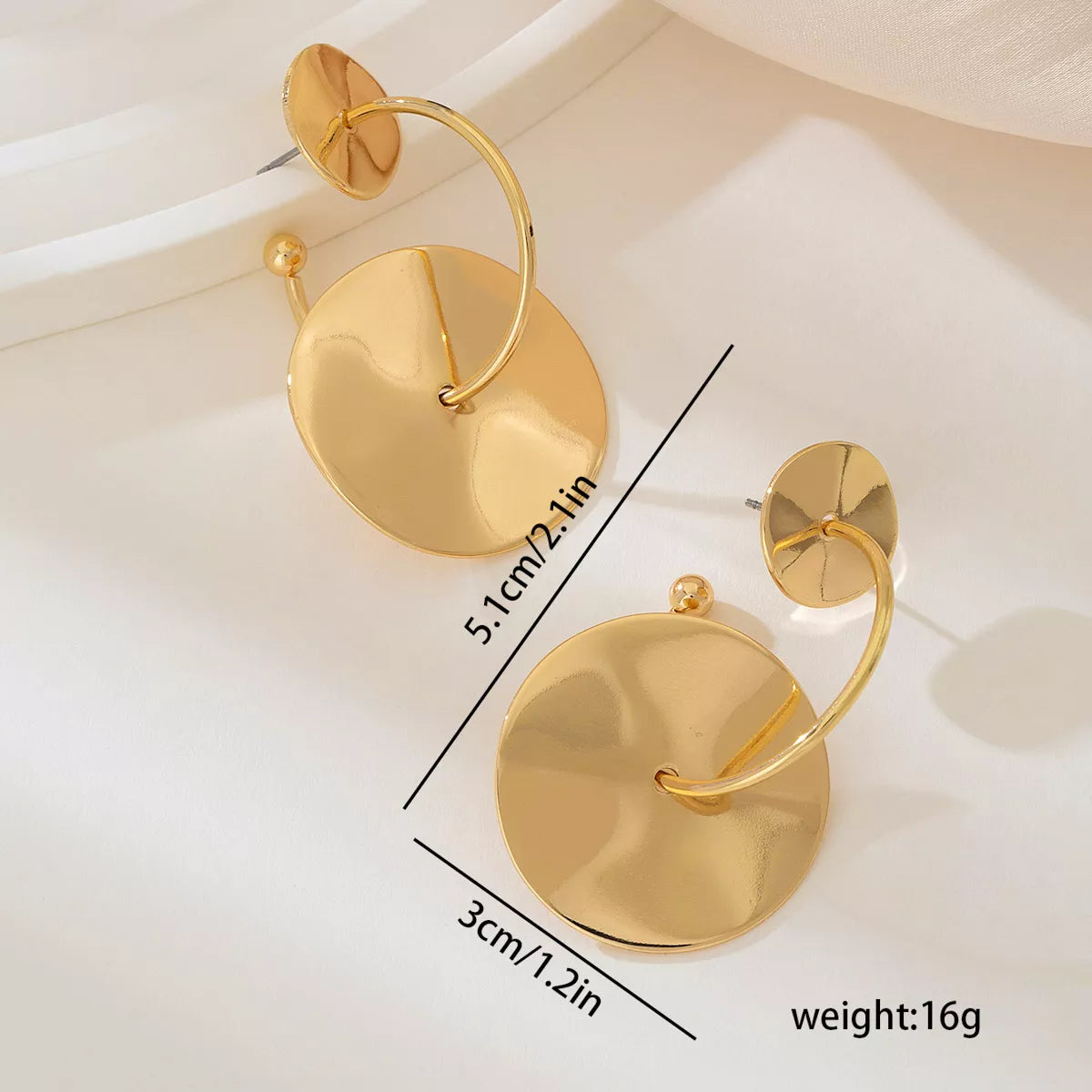 Gold-plated geometric circle drop earrings with modern design, featuring sleek gold finish and stylish dangle style.
