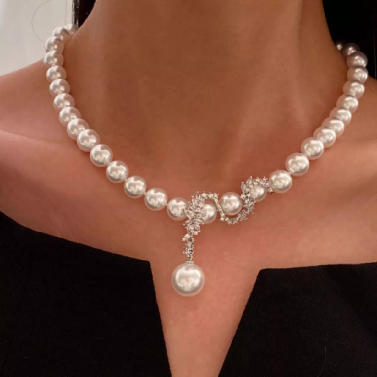 Elegant zircon pearl necklace from Plush Fashion Hub featuring shimmering pearls and a delicate chain.