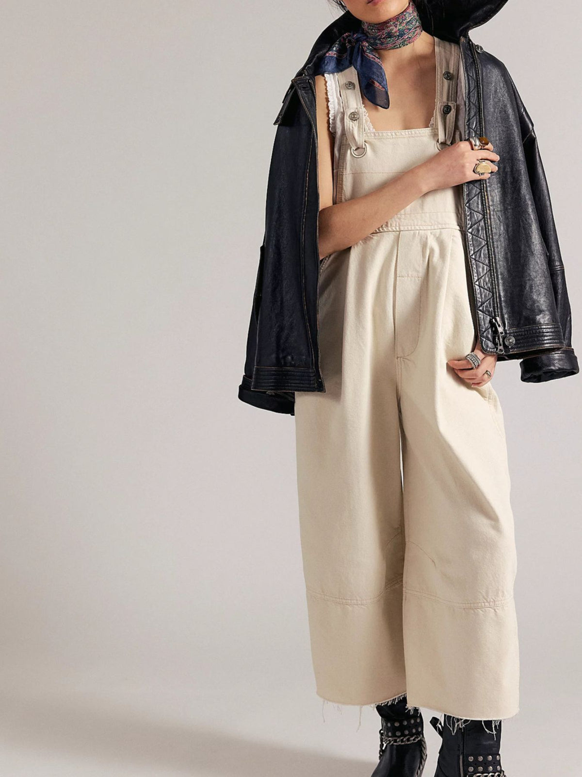 Lightweight casual denim jumpsuit with raw hem, wide-leg style from Plush Fashion Hub, featuring adjustable straps and relaxed fit.