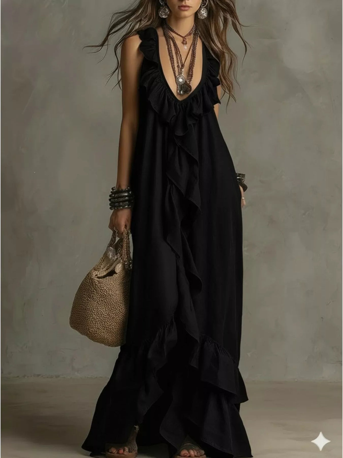 Ruffled sleeveless maxi dress in flowing fabric by Plush Fashion Hub, featuring a fitted bodice and layered ruffle details.
