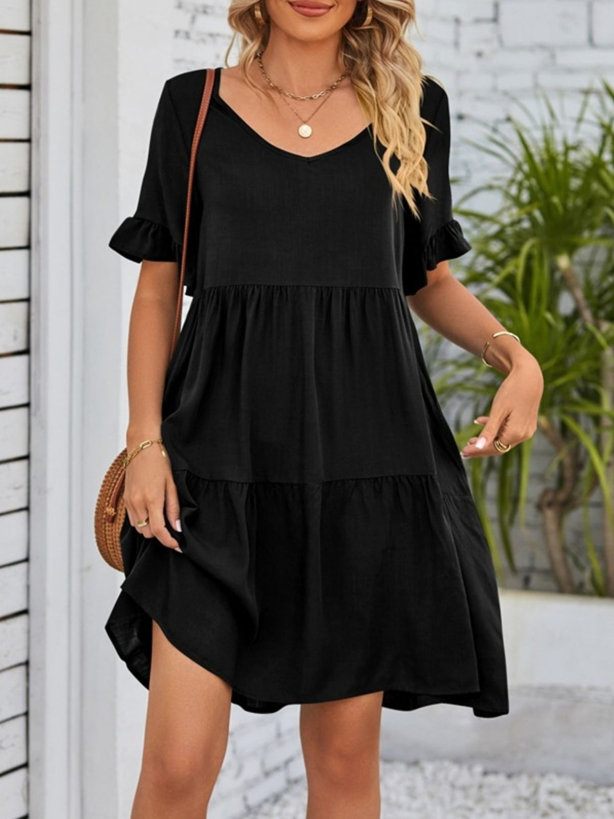 Lightweight rayon mini dress with ruffled sleeves, tiered design, and pockets from Plush Fashion Hub.