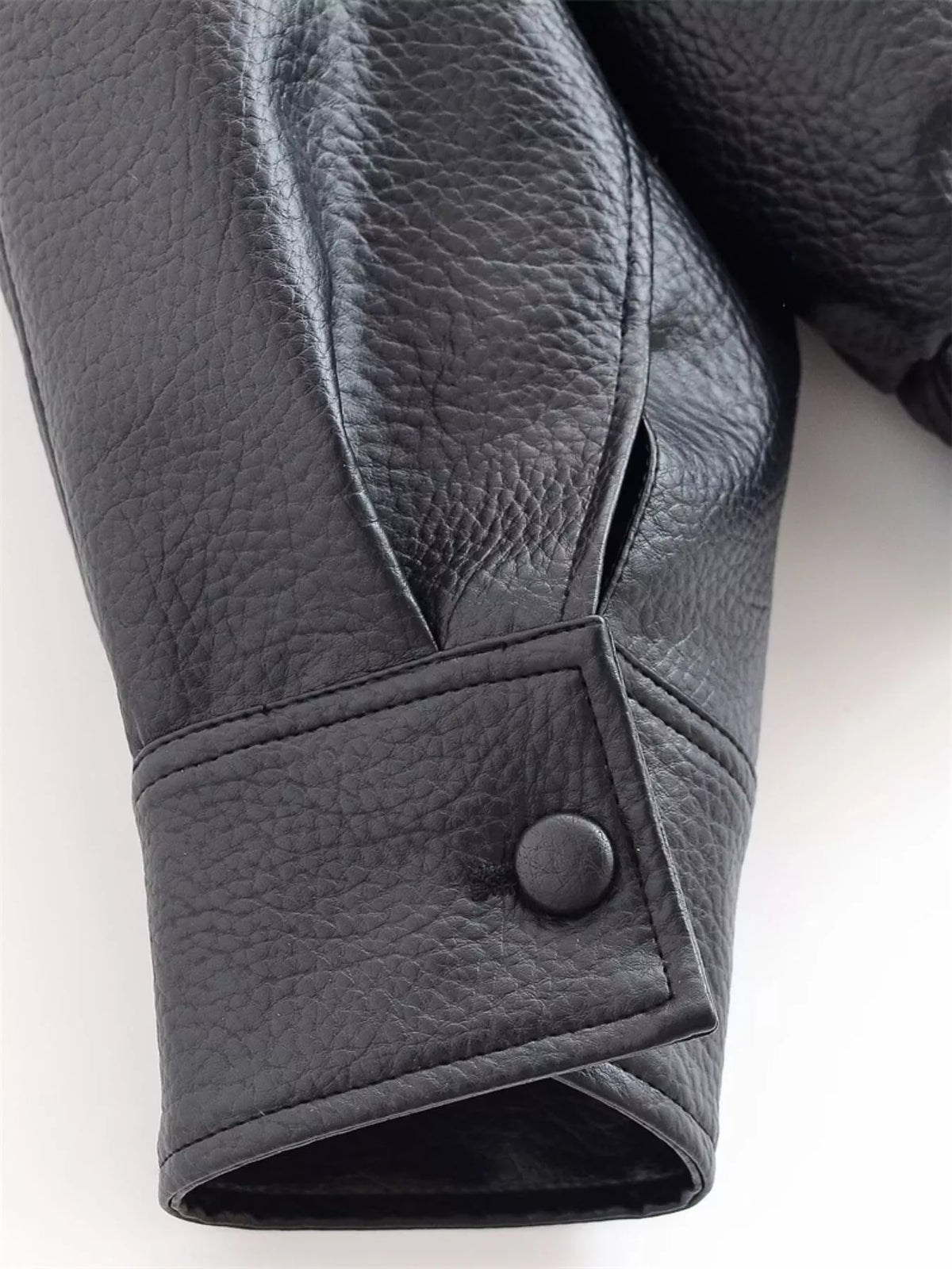 Trendsi women's asymmetrical faux leather moto jacket with stylish design, black color, and fitted silhouette.