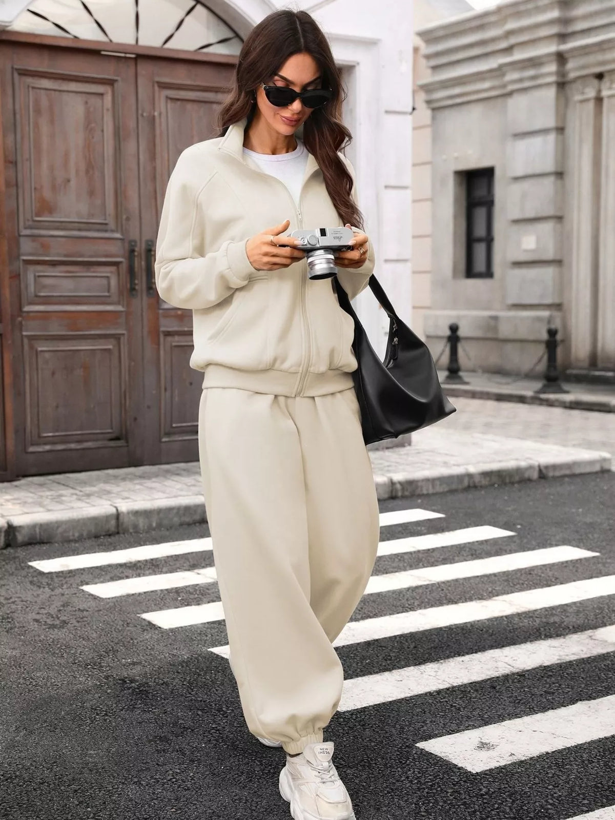 Women's zip-up long sleeve top and pants set by Trendsi, comfortable casual loungewear with a coordinated fit.