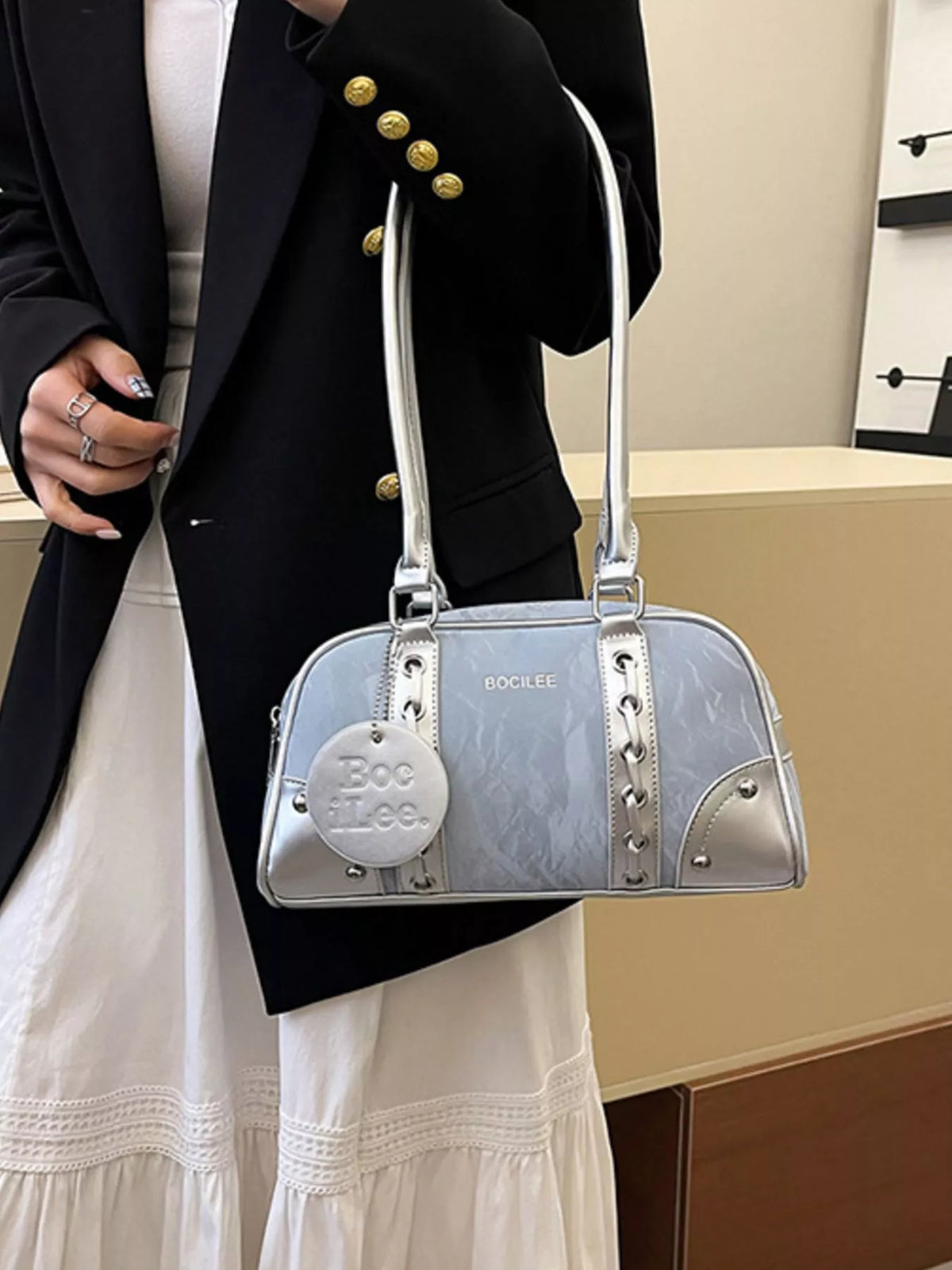 Plush Fashion Hub top handle shoulder bag with sleek design, featuring a structured shape and stylish strap for versatile carry.