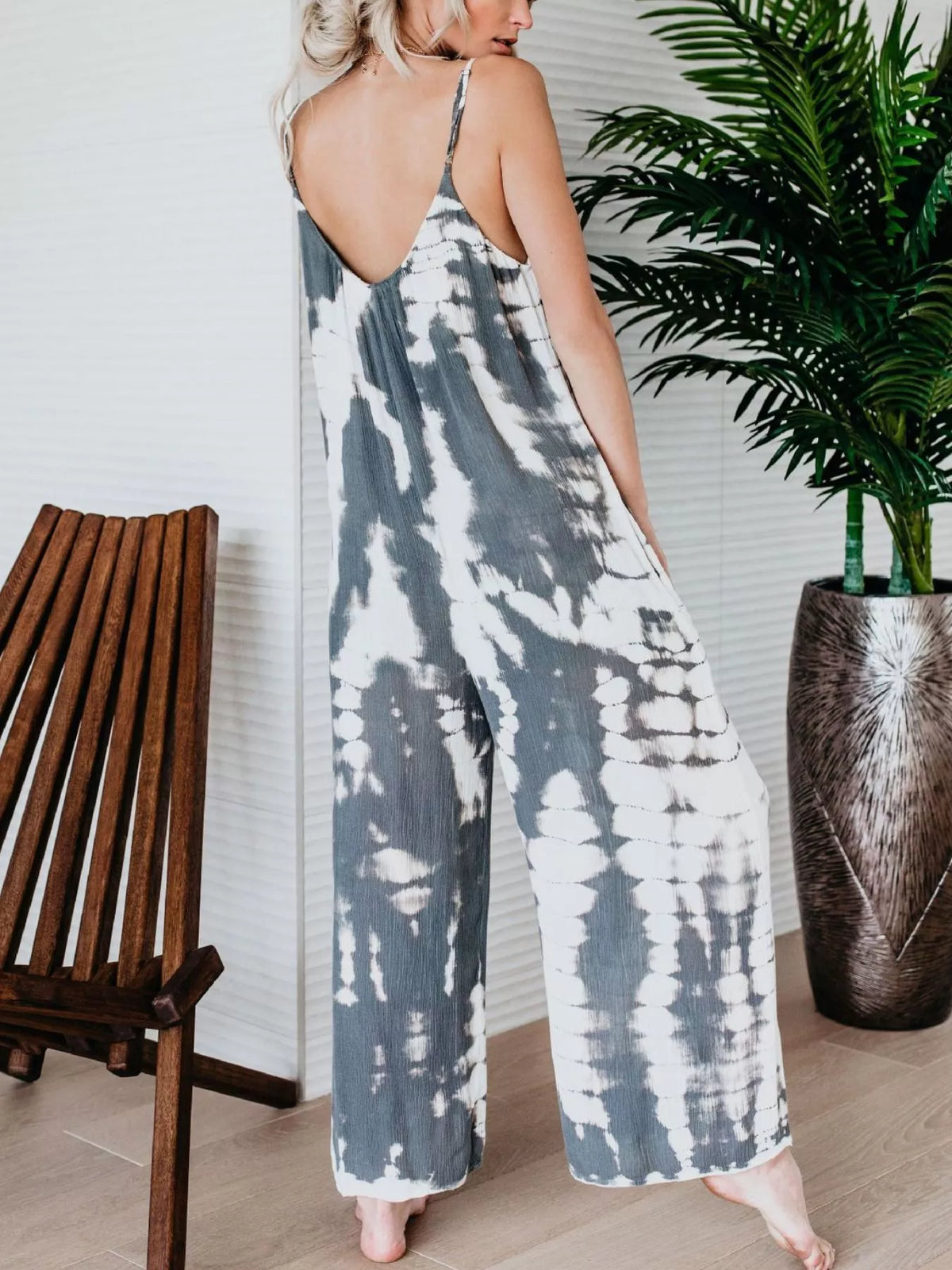 Plus size tie-dye wide leg jumpsuit by Plush Fashion Hub, featuring a full-length design and vibrant colorful pattern.