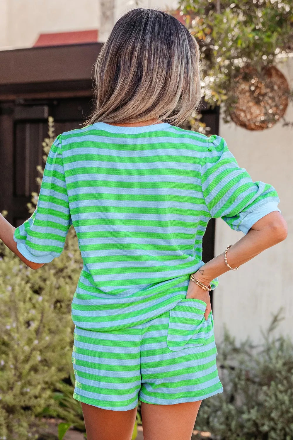 Stripe colorblock puff sleeve top and drawstring shorts matching set by Plush Fashion Hub, featuring bold stripes and casual style.