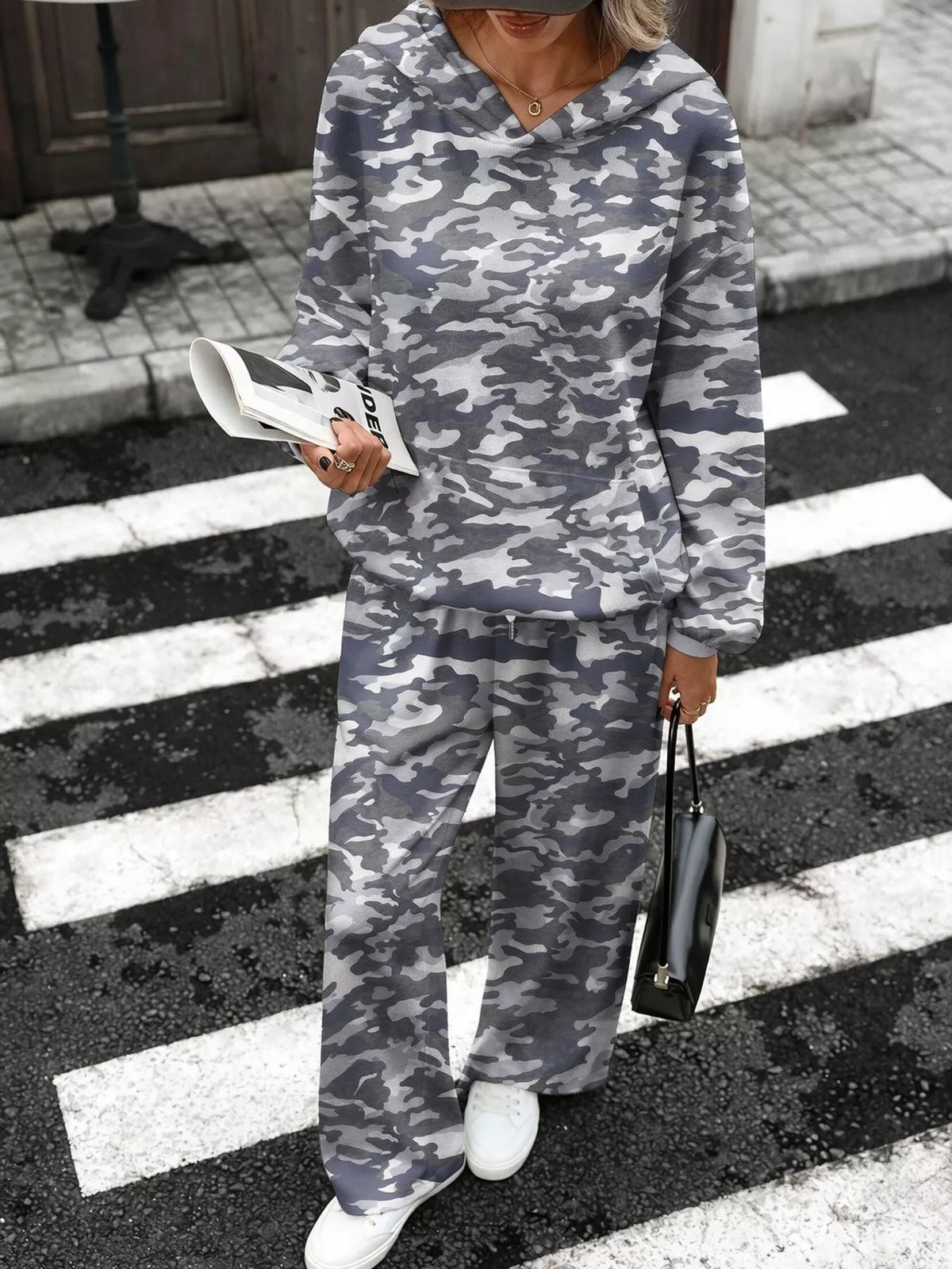 Printed long sleeve hoodie and pants set by Trendsi, featuring a comfortable matching outfit with colorful design details.