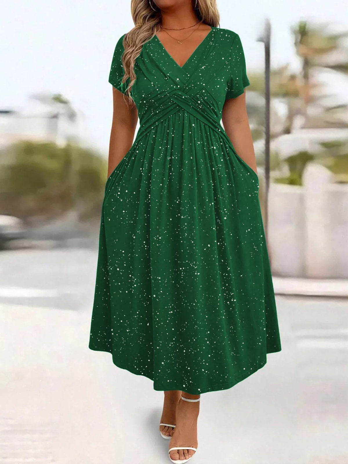 Plus size glitter flutter sleeve midi dress by Trendsi, featuring a shimmering fabric and elegant flutter sleeves for a stylish look.