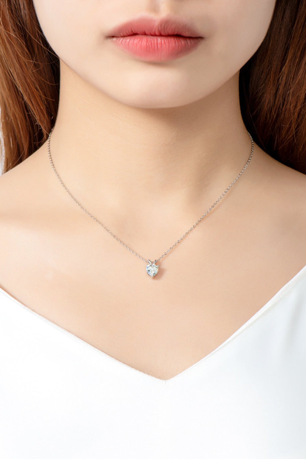 Heart-shaped 1 carat moissanite pendant necklace featuring a sparkling gemstone on a delicate chain, from Plush Fashion Hub.